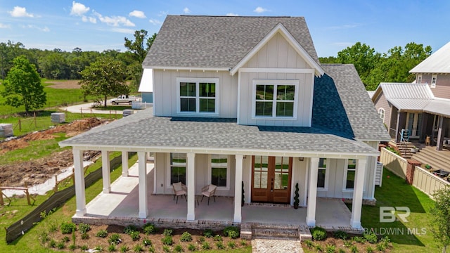 15132 Itea Dr, Foley, AL 36535 - modern farmhouse style home featuring board and batten siding, a shingled roof, and french doors