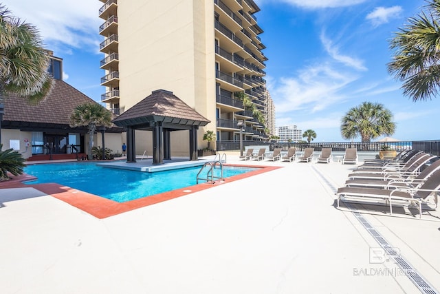 view of pool featuring a gazebo and a patio area