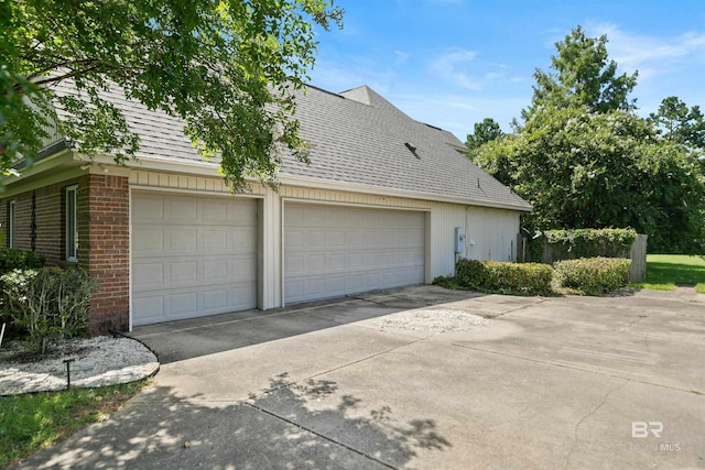 view of side of property featuring a garage