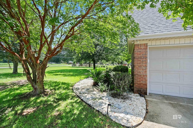 view of yard with a garage