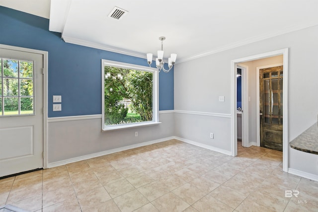 unfurnished dining area with crown molding, plenty of natural light, and a notable chandelier