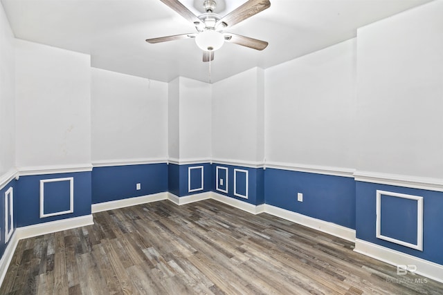 unfurnished room featuring dark hardwood / wood-style floors and ceiling fan