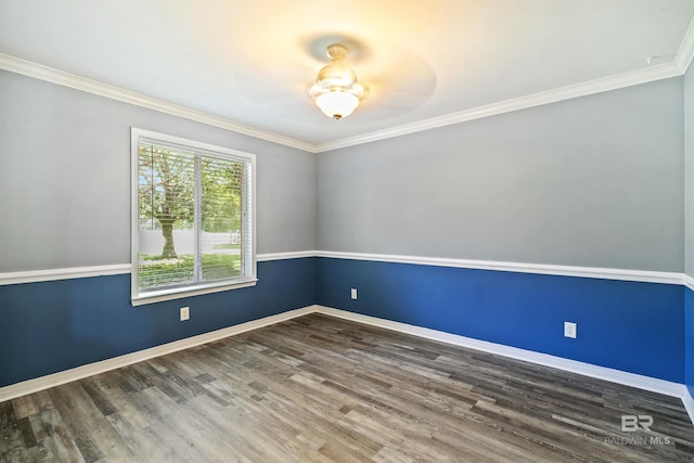 spare room featuring ceiling fan, dark hardwood / wood-style flooring, and ornamental molding