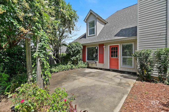 property entrance featuring a patio area