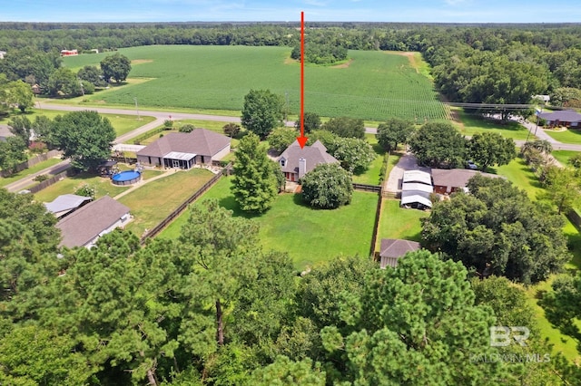 birds eye view of property with a rural view