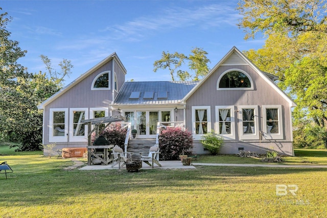 rear view of property with a patio area and a yard