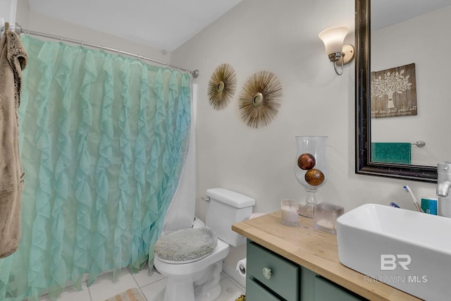 bathroom featuring tile patterned flooring, curtained shower, toilet, and sink