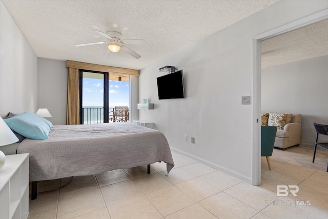 bedroom with light tile patterned floors, a ceiling fan, a textured ceiling, access to outside, and baseboards