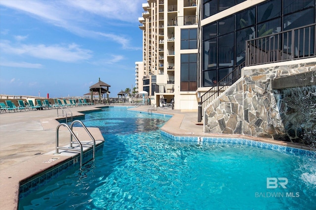 community pool with a patio