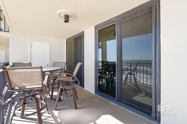 balcony with outdoor dining area