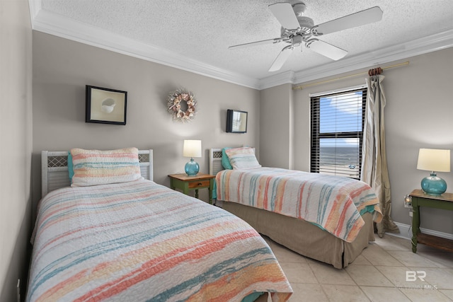 bedroom featuring ornamental molding, light tile patterned floors, ceiling fan, and a textured ceiling