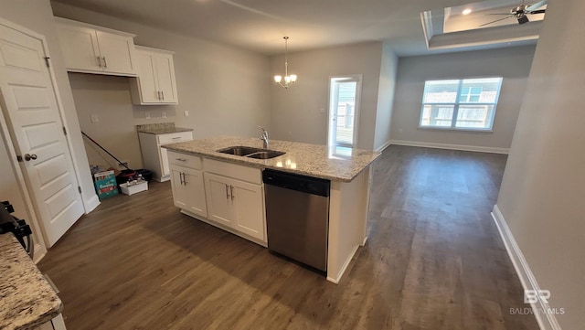 kitchen featuring white cabinetry, stainless steel dishwasher, sink, and light stone counters