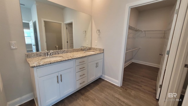 bathroom with vanity and hardwood / wood-style floors