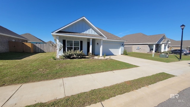 view of front of house with a garage and a front yard