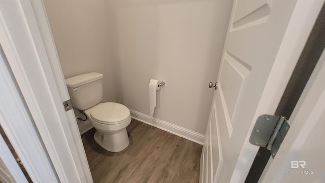 bathroom featuring toilet and hardwood / wood-style floors