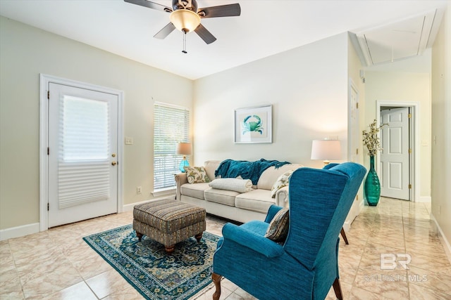 living room with ceiling fan and light tile floors