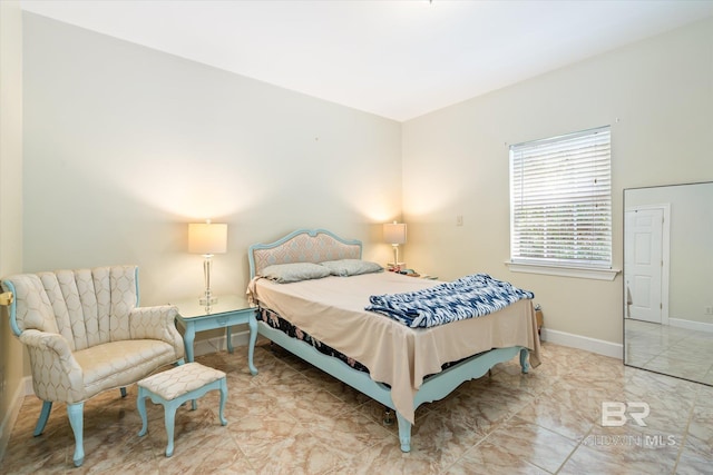 bedroom featuring tile floors