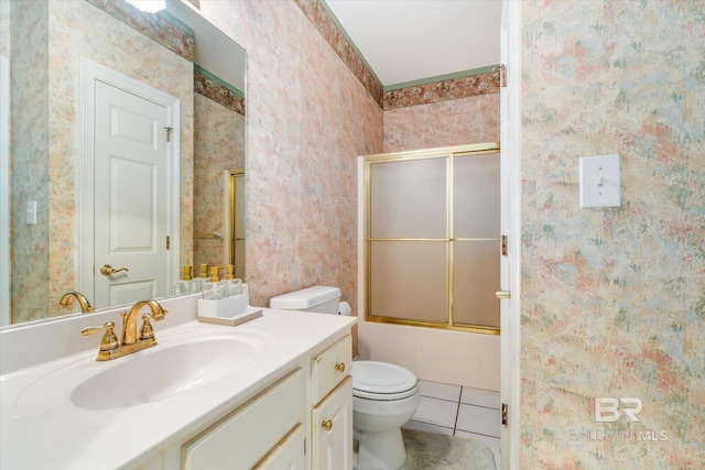 full bathroom featuring tile floors, shower / bath combination with glass door, toilet, and oversized vanity