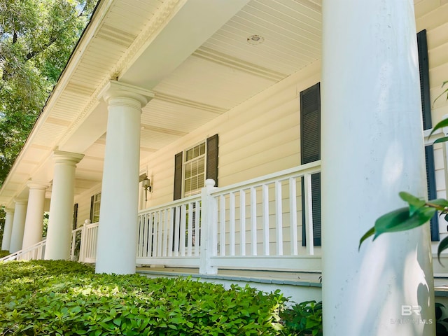 view of side of home with covered porch