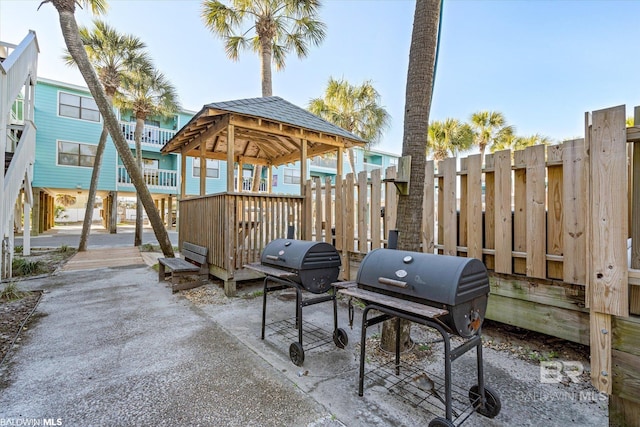 728 W Beach Blvd Unit 121, Gulf Shores, AL 36542 - view of patio featuring fence and area for grilling