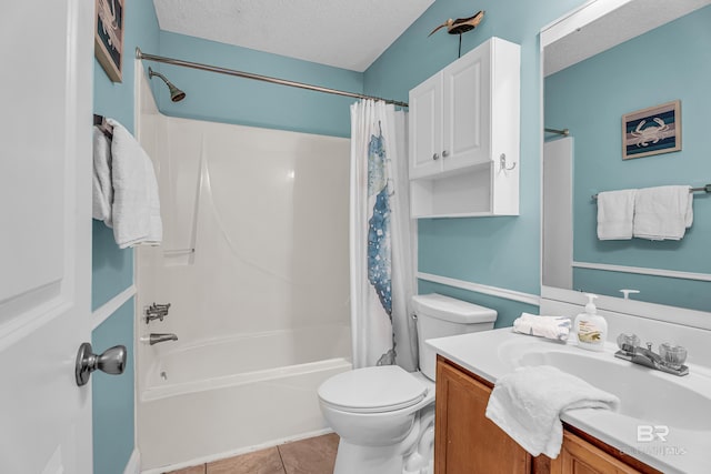 728 W Beach Blvd Unit 121, Gulf Shores, AL 36542 - bathroom featuring shower / tub combo, a textured ceiling, toilet, tile patterned flooring, and vanity