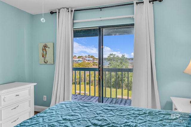 728 W Beach Blvd Unit 121, Gulf Shores, AL 36542 - bedroom with access to outside and baseboards