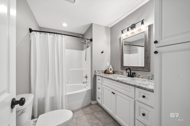 bathroom featuring toilet, tile patterned floors, shower / bath combination with curtain, and vanity