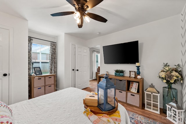 bedroom featuring ceiling fan and wood finished floors
