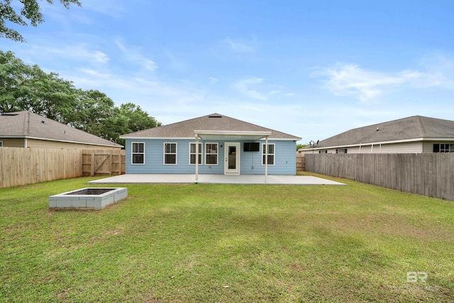 rear view of property with roof with shingles, a fenced backyard, a garden, a patio area, and a yard