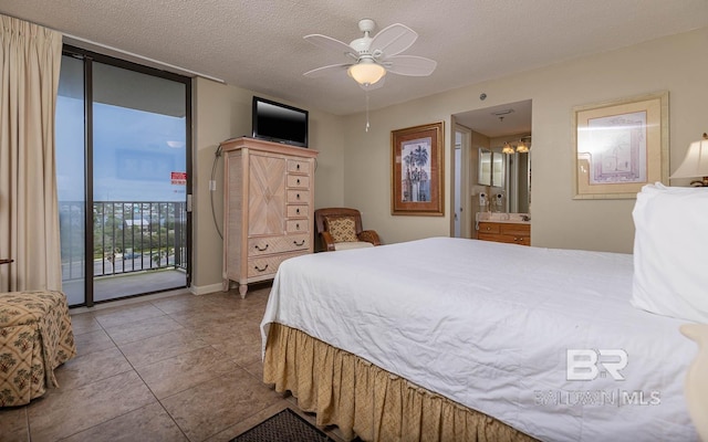 bedroom with access to outside, tile patterned floors, ensuite bathroom, ceiling fan, and a textured ceiling