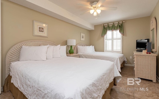 tiled bedroom with ceiling fan