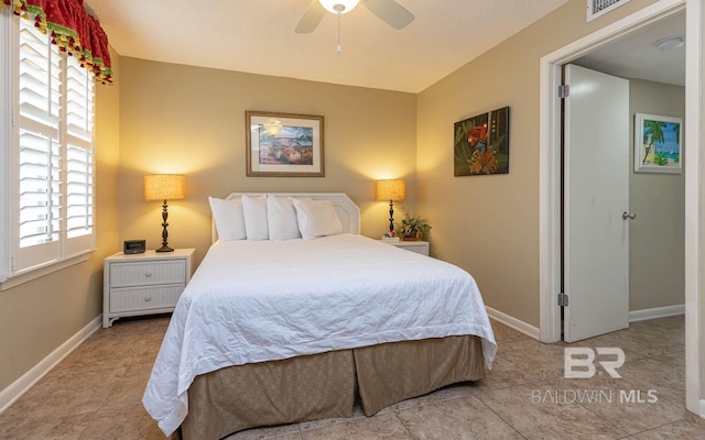 bedroom featuring ceiling fan and light tile patterned flooring