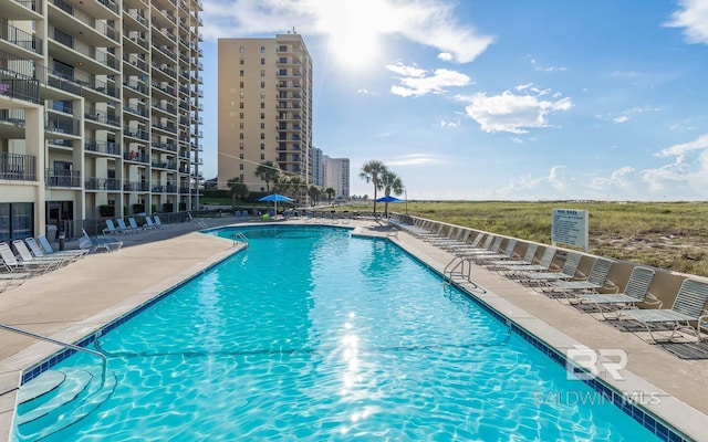 view of swimming pool with a patio