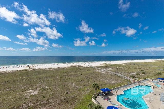 bird's eye view with a view of the beach and a water view