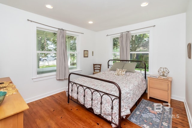 bedroom featuring wood-type flooring