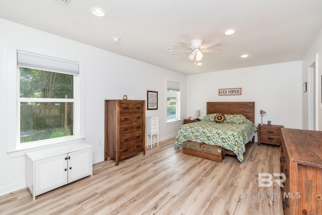 bedroom featuring ceiling fan and light hardwood / wood-style floors