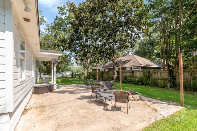 view of patio / terrace featuring a fire pit