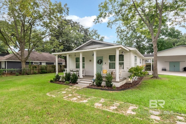 bungalow-style house featuring a front yard and covered porch