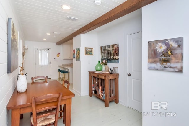 dining room featuring beam ceiling