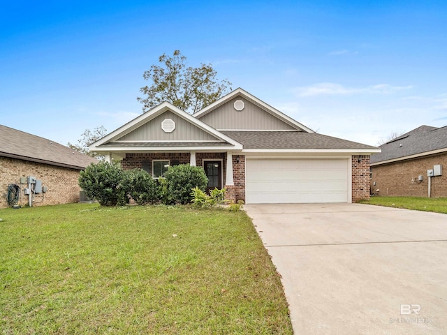 view of front of home with a front yard and a garage