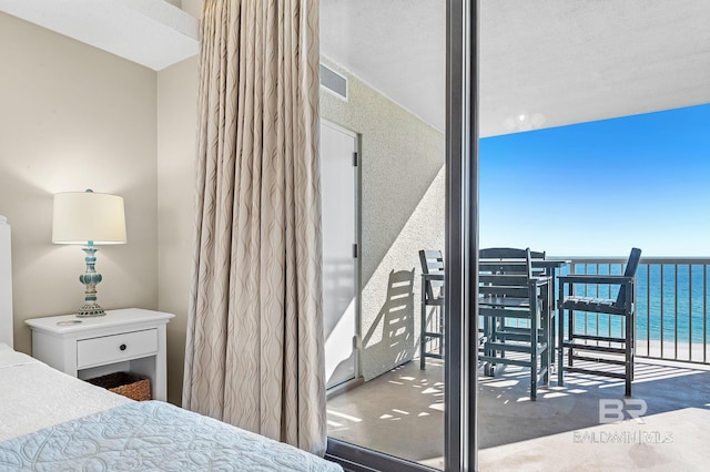25020 Perdido Beach Blvd Unit 804B, Orange Beach, AL 36561 - bedroom featuring a water view and a wall of windows