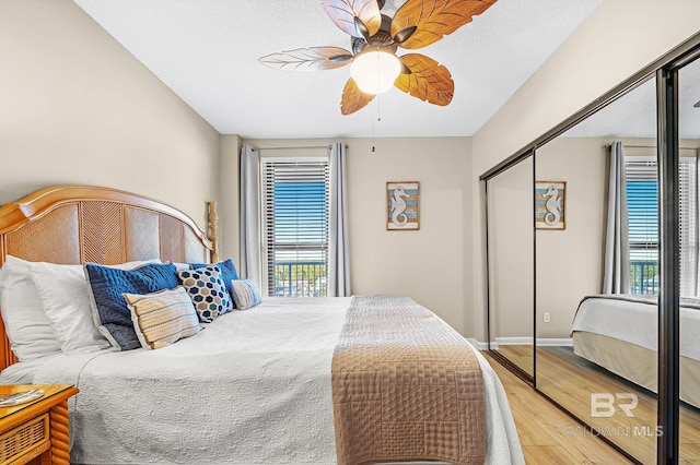 25020 Perdido Beach Blvd Unit 804B, Orange Beach, AL 36561 - bedroom with hardwood / wood-style floors, ceiling fan, and a closet