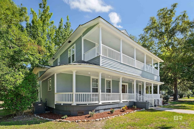 exterior space with a balcony, central AC, and covered porch