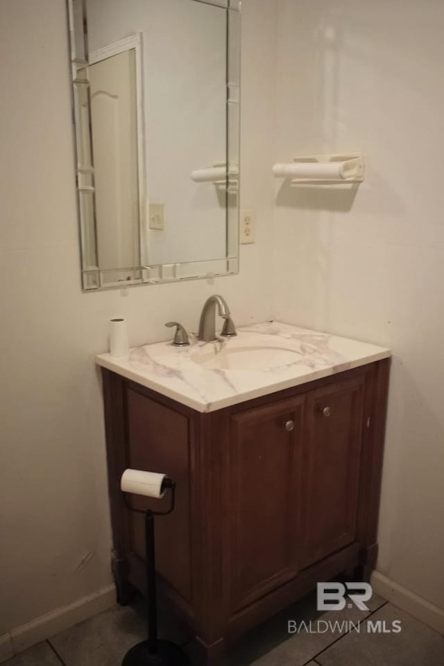 bathroom featuring tile flooring and vanity