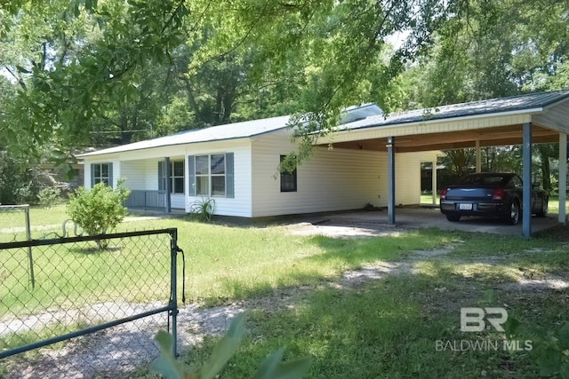 exterior space with a front yard and a carport