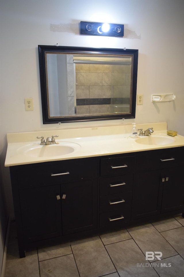 bathroom featuring tile floors and double sink vanity