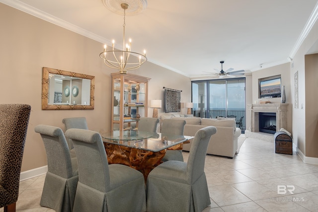 tiled dining space with crown molding and ceiling fan with notable chandelier