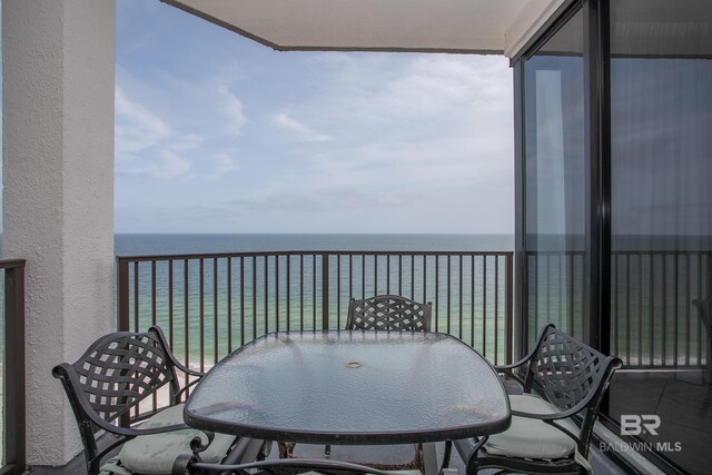 balcony featuring a water view