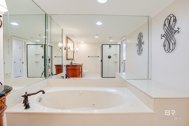 bathroom with vanity and shower with separate bathtub