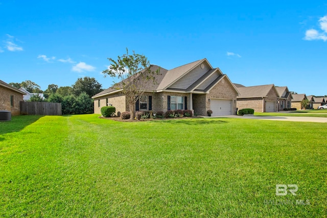 view of front of house featuring a garage, central AC, and a front lawn